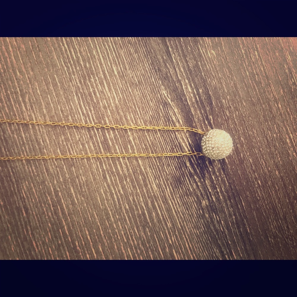 Henri Bendel long gold chain necklace with globe